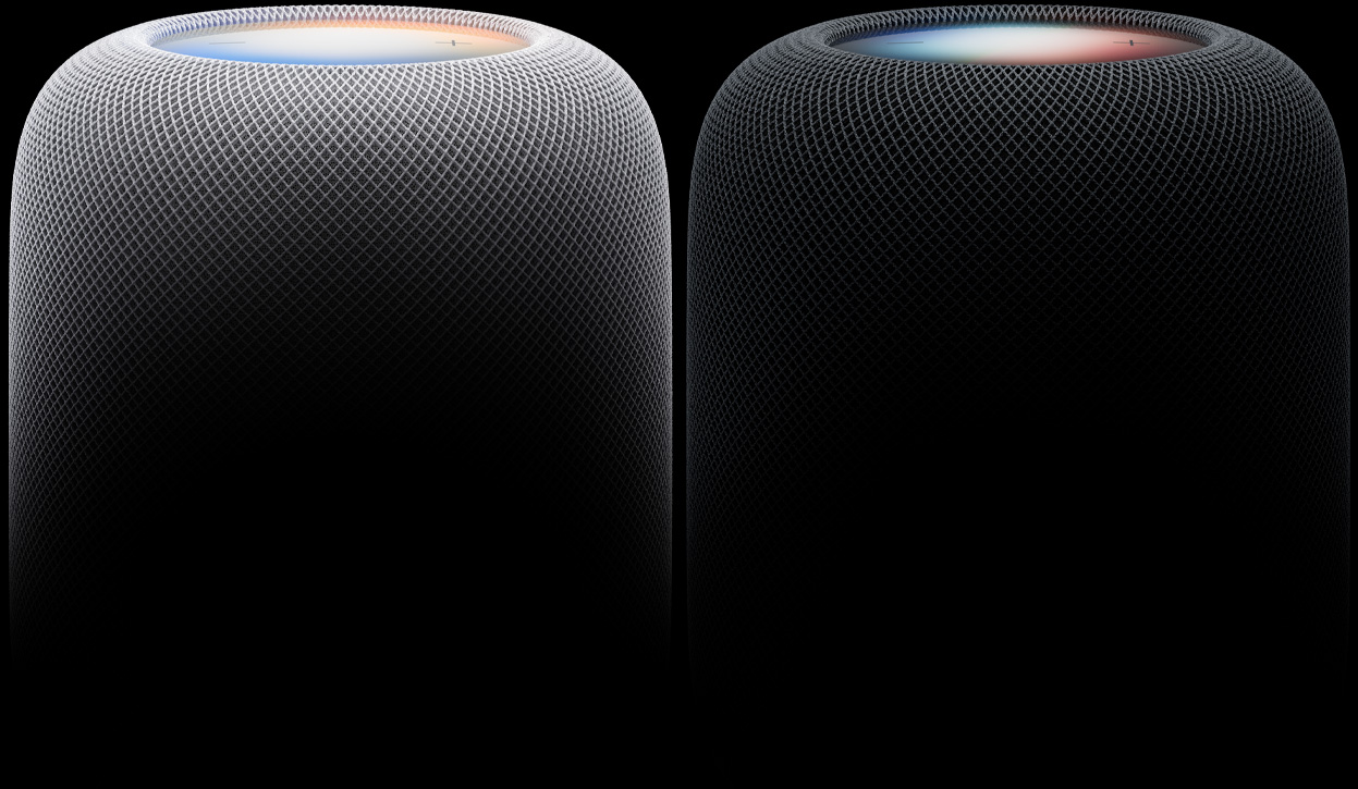 Due altoparlanti HomePod affiancati nei colori bianco e mezzanotte, tessuto acustico intrecciato, superfici touch illuminate