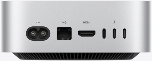 Hõbedase Mac mini tagantvaade näitab tagumisi liideseid: toiteliidest, Etherneti liidest, HDMI liidest ja kolme Thunderbolti liidest.