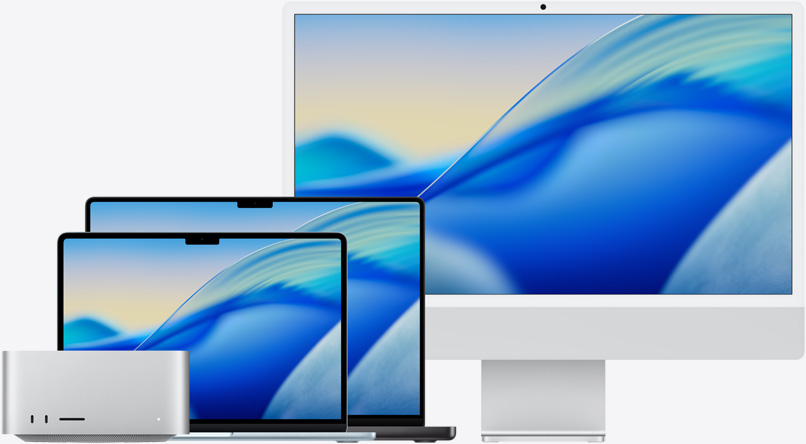 إحدى خلفيات نظام macOS Tahoe تظهر على شاشة مجموعة من موديلات Mac من اليسار إلى اليمين: Mac Studio،‏ وMacBook Air مقاس 13 إنش باللون الأزرق السماوي، وMacBook Pro مقاس 14 إنش باللون الأسود الفلكي، وiMac مقاس 24 إنش باللون الفضي